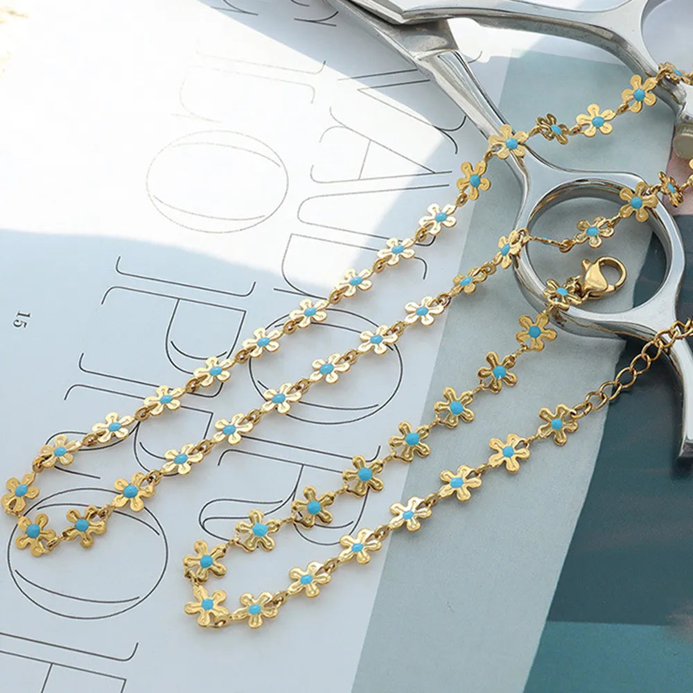 Bracelet Fleur Goutte – Acier Titane Doré & Goutte d’Huile
