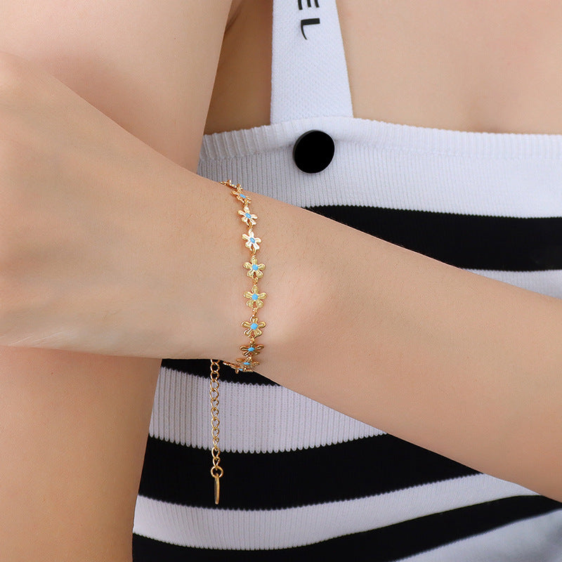 Bracelet Fleur Goutte – Acier Titane Doré & Goutte d’Huile