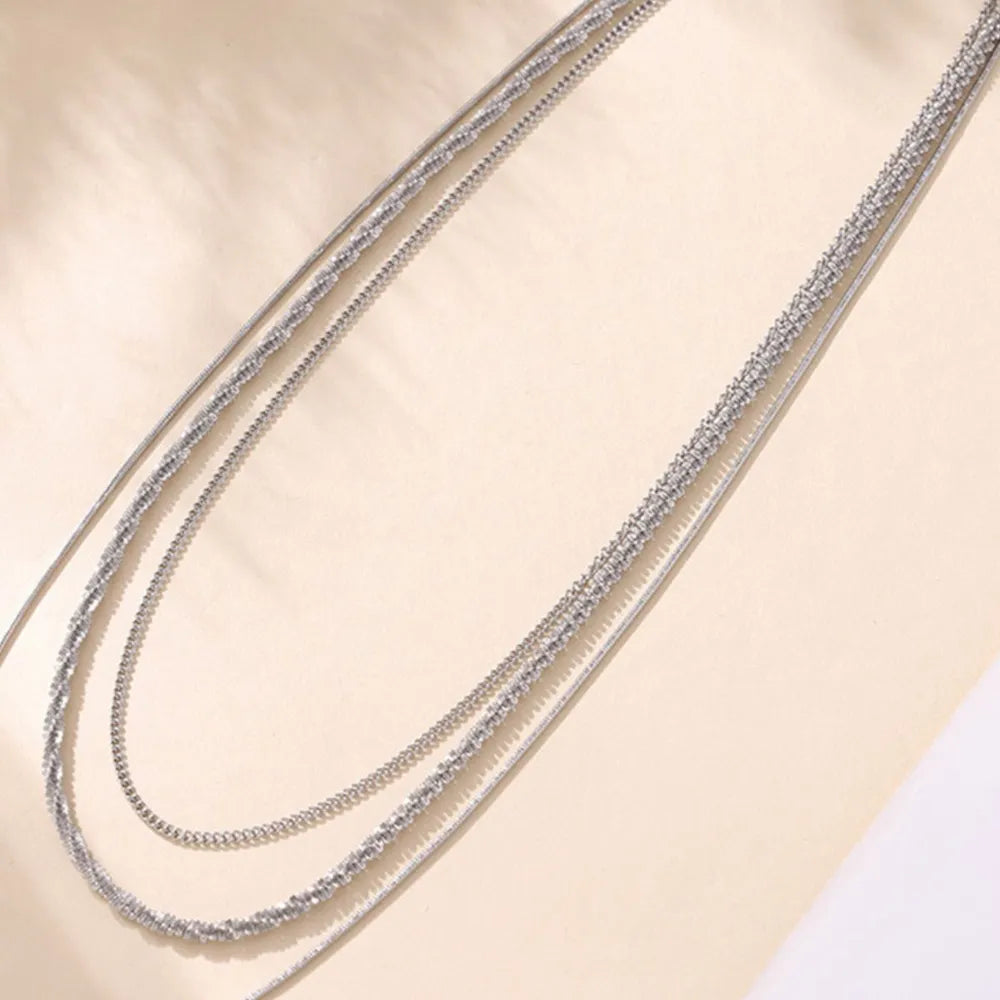 Collier Multi-Rangs Acier Titane – Élégance Superposée