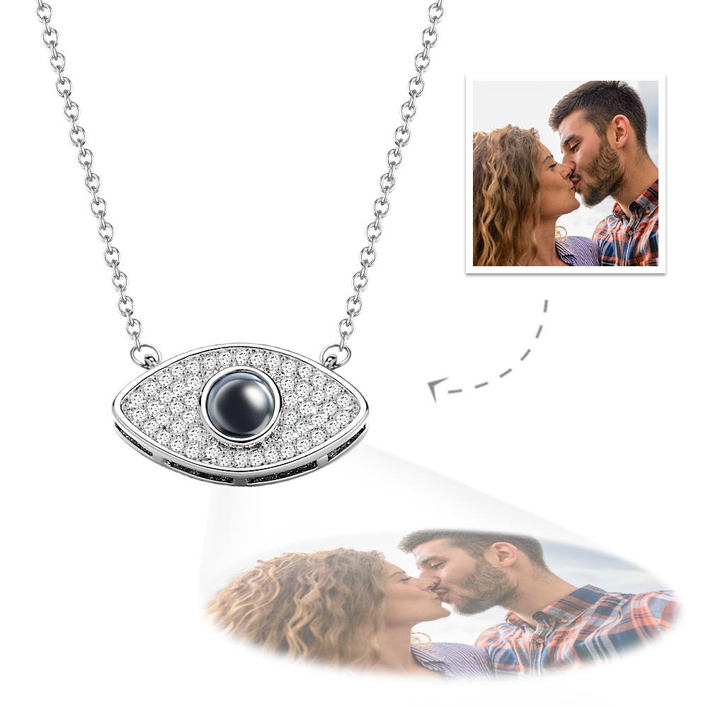 Evil eye projection necklace with custom photo for women. Silver pendant with crystal details. Ideal gift for anniversary.