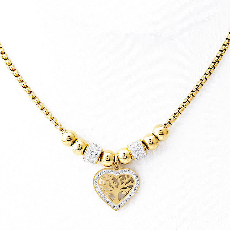 Collier “Arbre du Cœur” – Pendentif doré & perles strassées